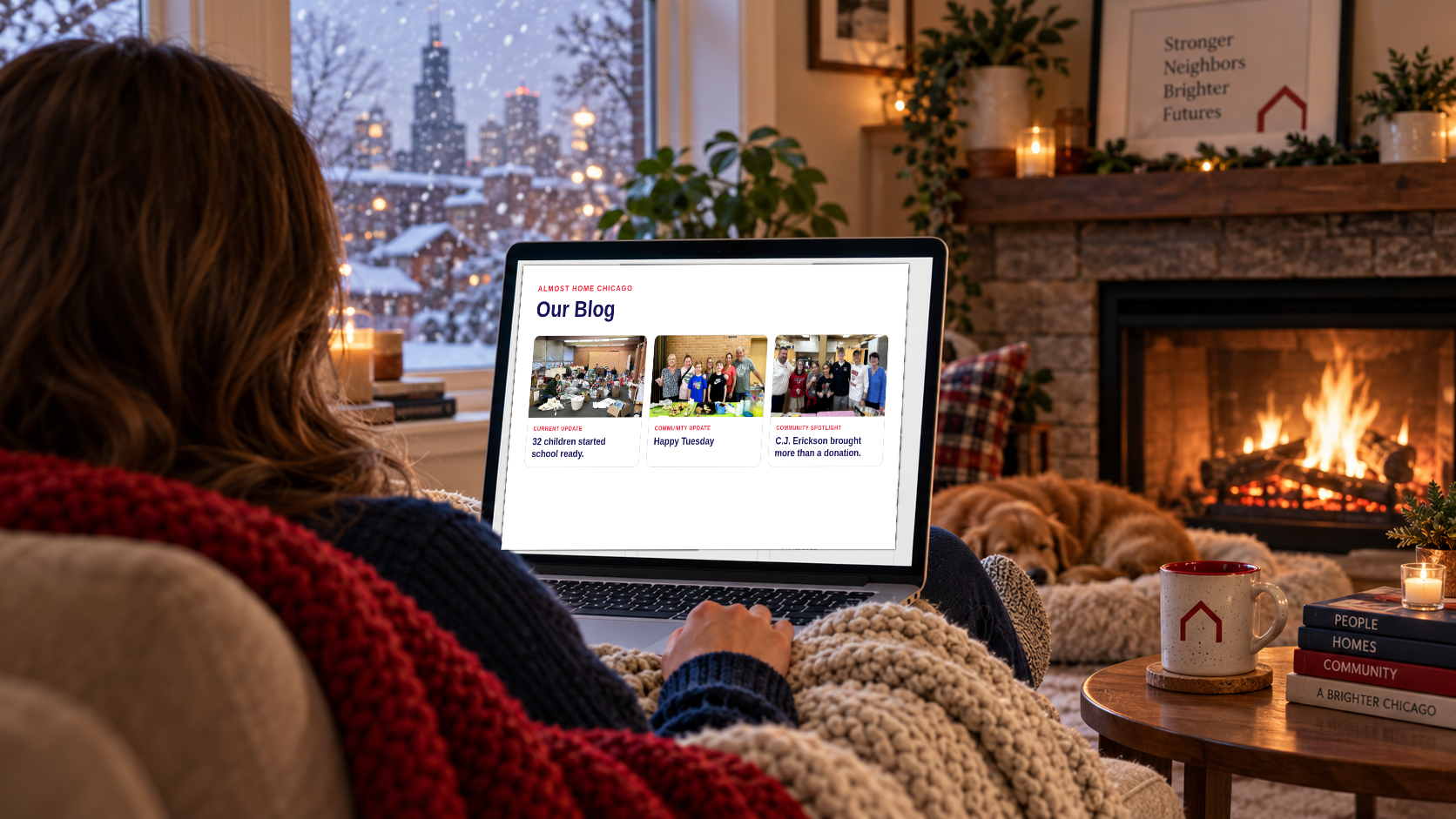 A reader settled into a comfortable chair by a fireplace, reading the Almost Home Chicago blog while snow falls outside