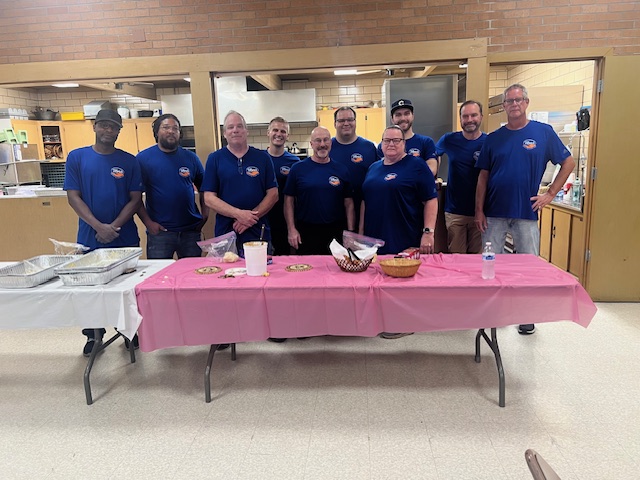 Almost Home Chicago Monday food team standing together before service